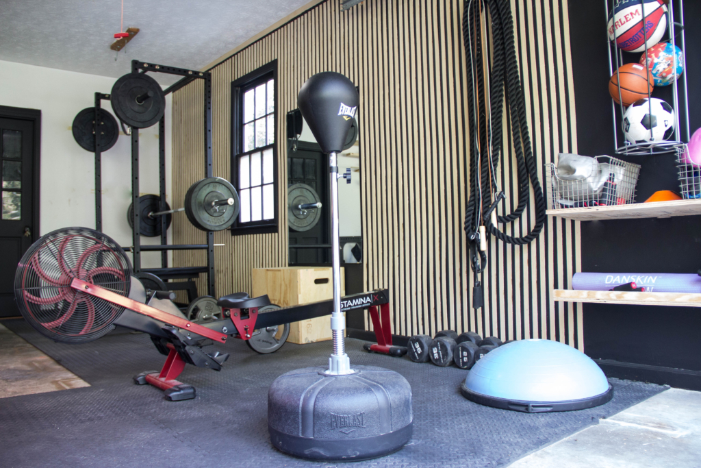 Easy DIY Slat Wall in a Garage Gym, Garage gym design, Home gym set-up
 